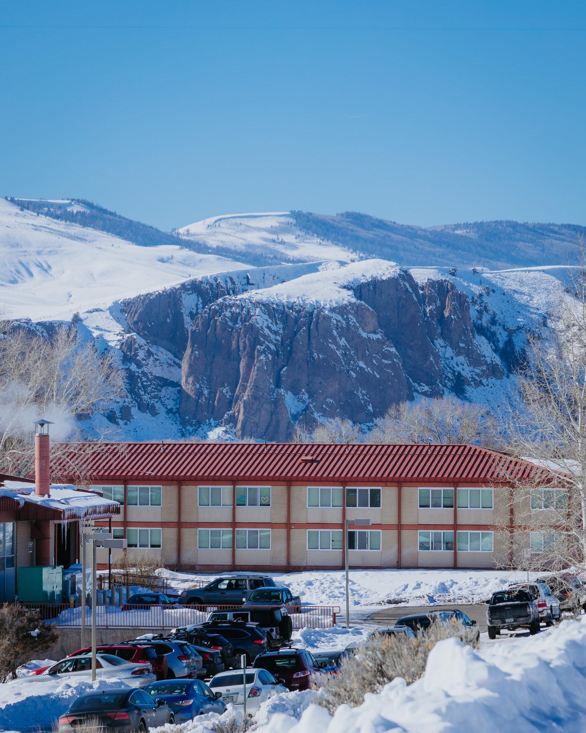 Colorado Hall with the Palisades in the background on a bluebird day.